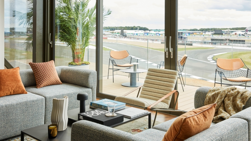 Trackside residence interior with view from balcony